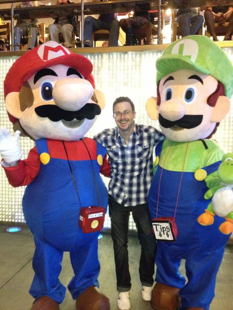 Jacob posing with Mario and Luigi 